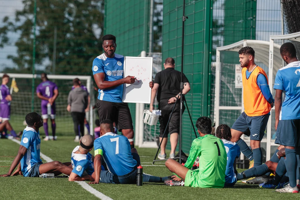A coach delivering a practical football session