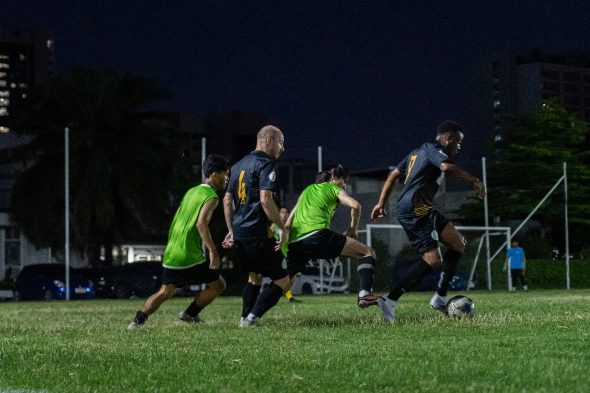 Football action under the floodlights