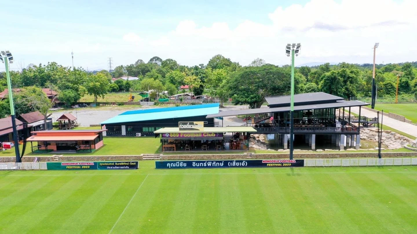 View across a football pitch towards the clubhouse