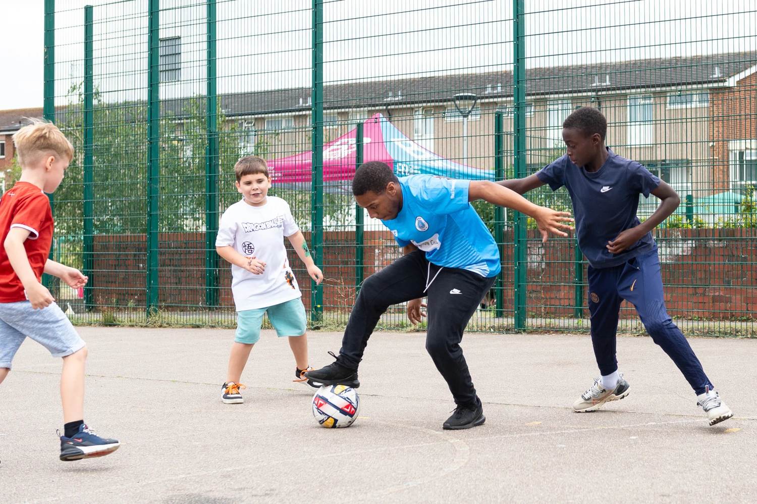 Players practising close control on an outdoor court